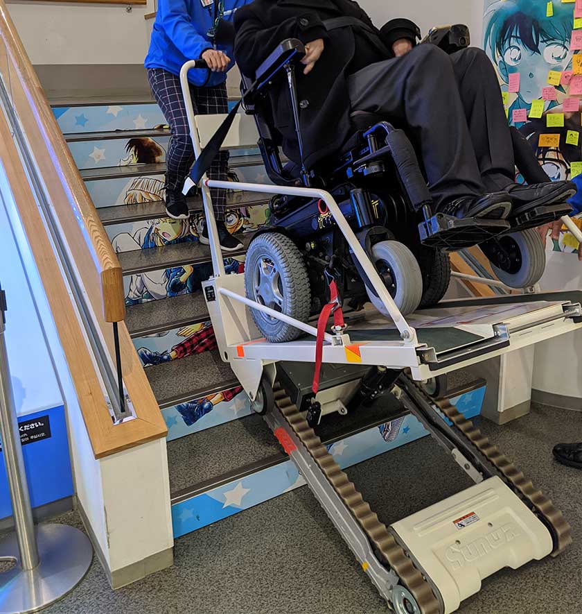 Wheelchair stair climber on the stairs at Gosho Aoyama Manga Factory