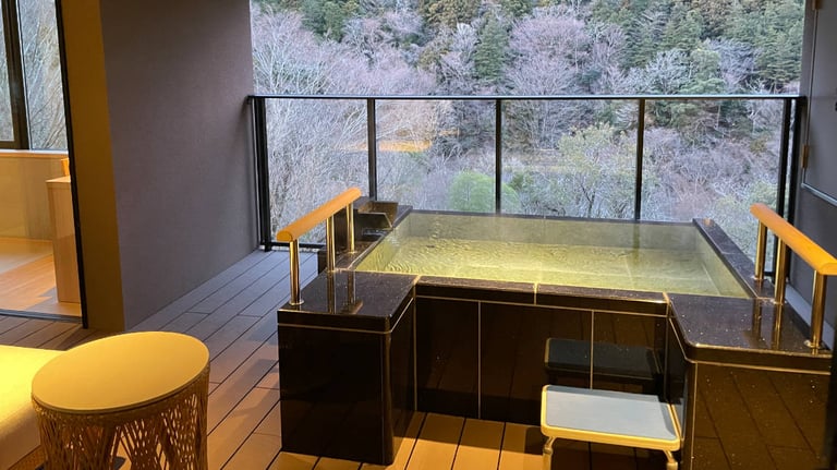 Balcony with private hot-spring-fed bath