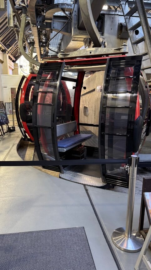 Cable car gondola with a bench that lifts for wheelchair access and no step entry. Cable car gondola with a bench that lifts for wheelchair access and no step entry.