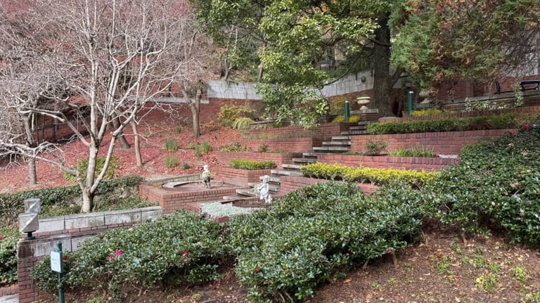 Tiered garden at Kobe Nunobiki Herb Gardens with multiple sets of brick steps. Tiered garden at Kobe Nunobiki Herb Gardens with multiple sets of brick steps.