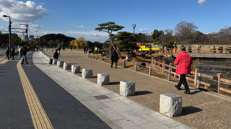 A pathway with tactile paving and stone blocks leads to the castle park. Inside, pathways lack tactile paving. A pathway with tactile paving and stone blocks leads to the castle park. Inside, pathways lack tactile paving.