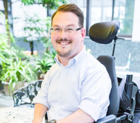 Josh Grisdale, a man in a power wheelchair
