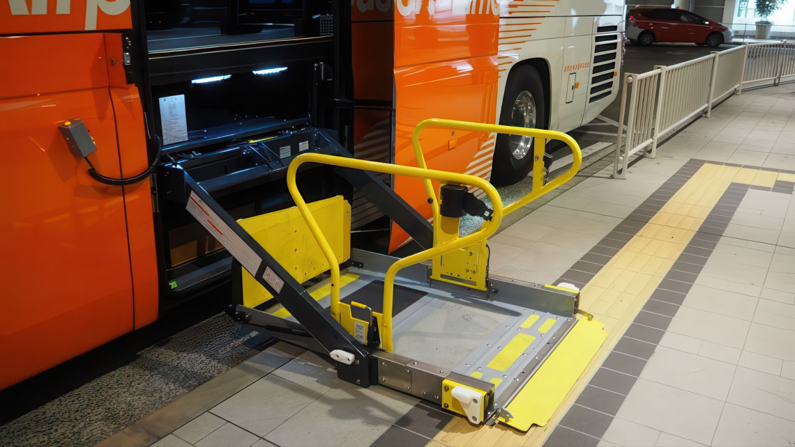 A wheelchair lift extended from a bus