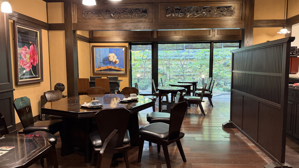 Coffee in a blue patterned cup and a red bean-filled sweet served on a tray at Kasanoya.