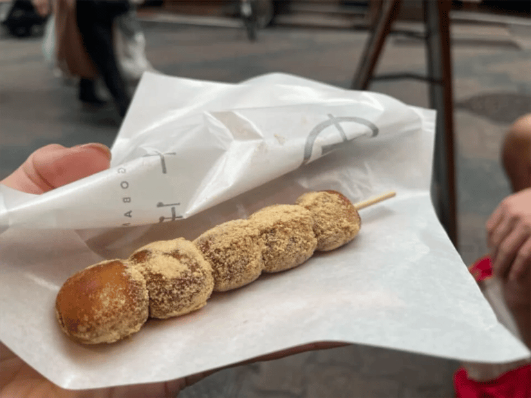 accessible karahori food tour kinako warabi mochi on skewer 768x576