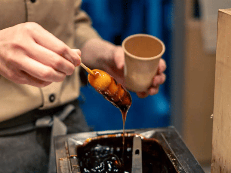 accessible karahori food tour mitarashi dango dipped in soy glaze 768x576