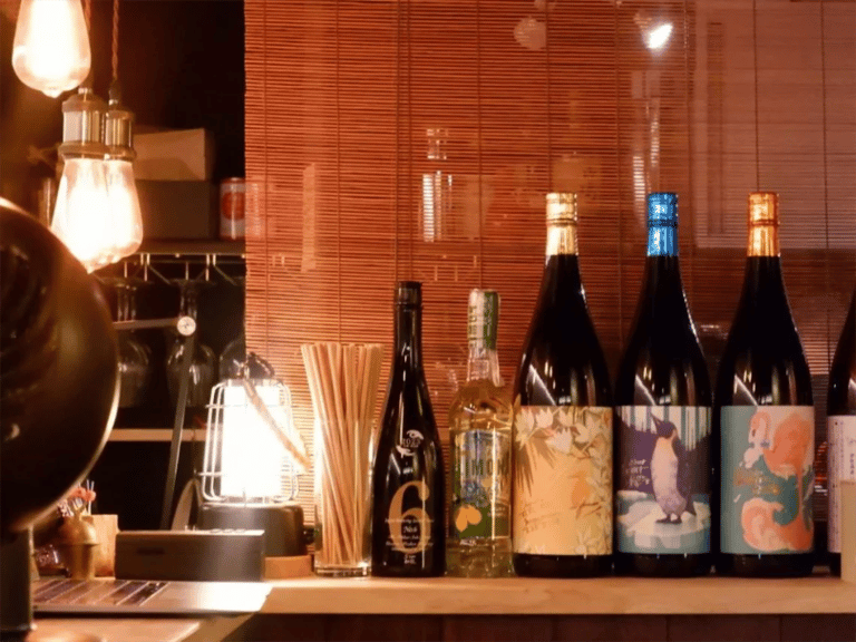 accessible kyoto sake tour craft sake bottles on bar shelf 768x576