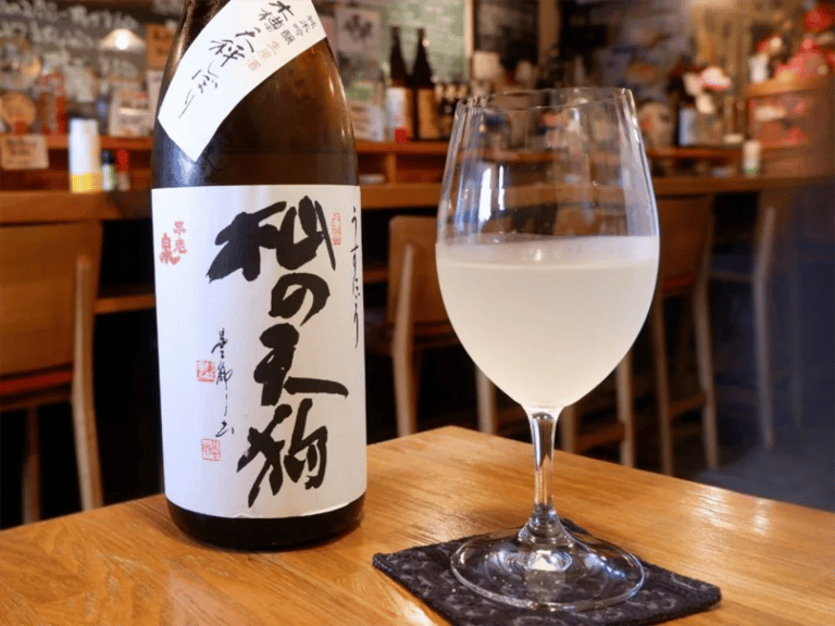 accessible kyoto sake tour nigori sake bottle and wine glass 768x576