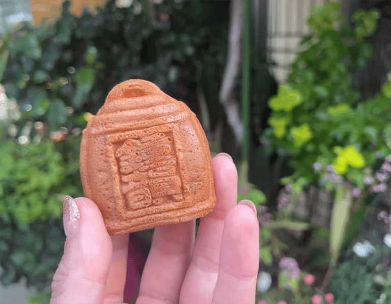 accessible osaka shinsekai daytime tour billiken shaped cake 768x597