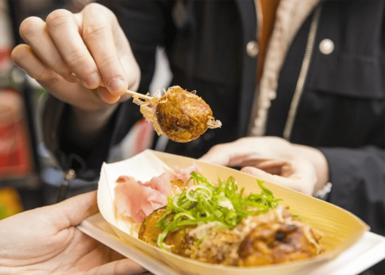 accessible osaka shinsekai daytime tour takoyaki on toothpick 768x549