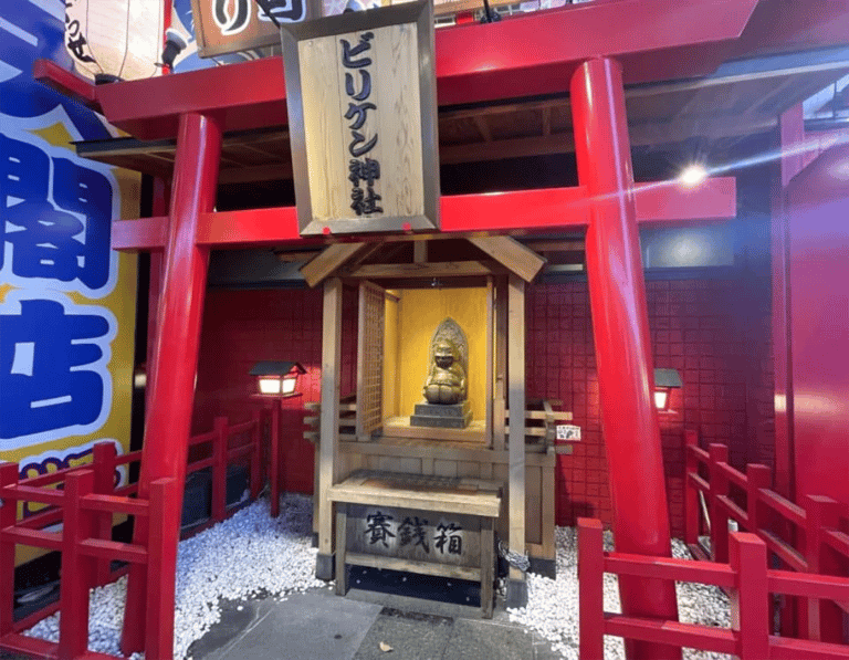 accessible osaka shinsekai evening tour billiken shrine red torii gate 768x598