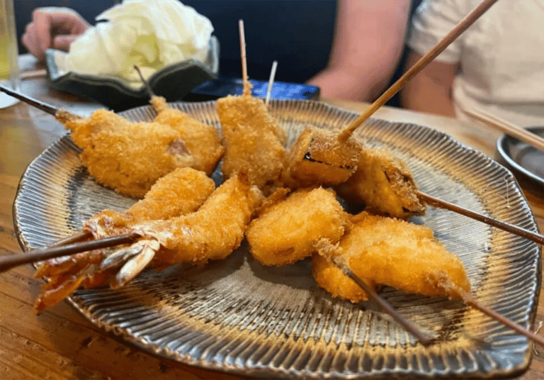 accessible osaka shinsekai evening tour kushikatsu deep fried skewers plate 768x536