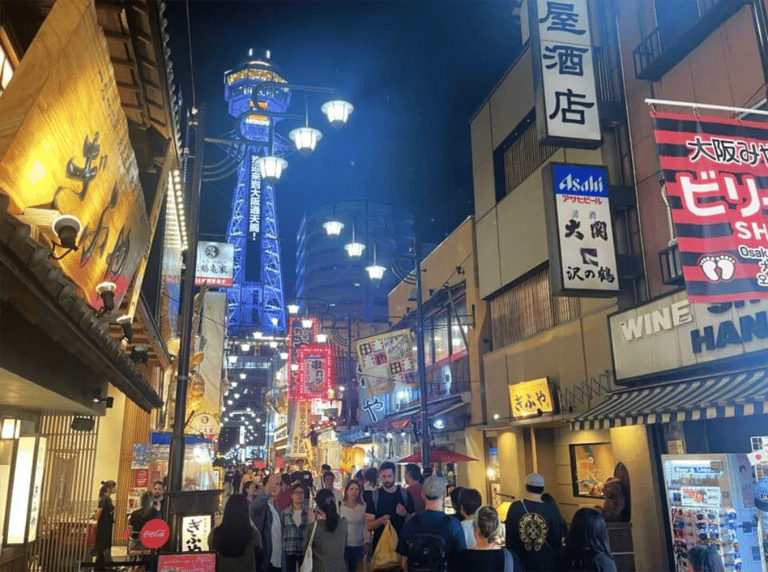accessible osaka shinsekai evening tour tsutenkaku tower view from street 768x573