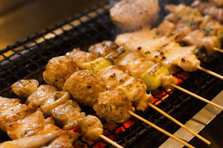 accessible shimbashi food tour yakitori grilling over charcoal 768x511