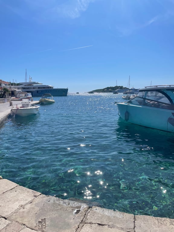 View across a calm anchorage near the Pakleni islands at sunset