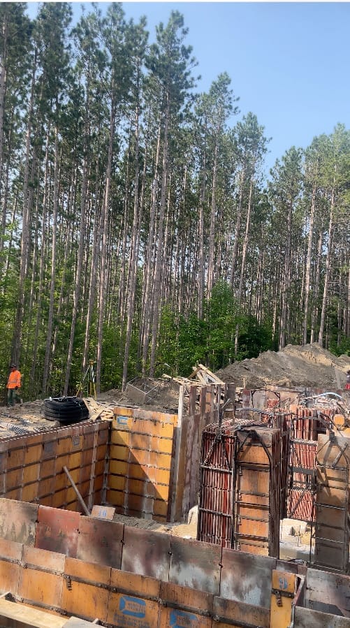 Formwork assembly and rebar installation for Aurora residential foundation construction in progress