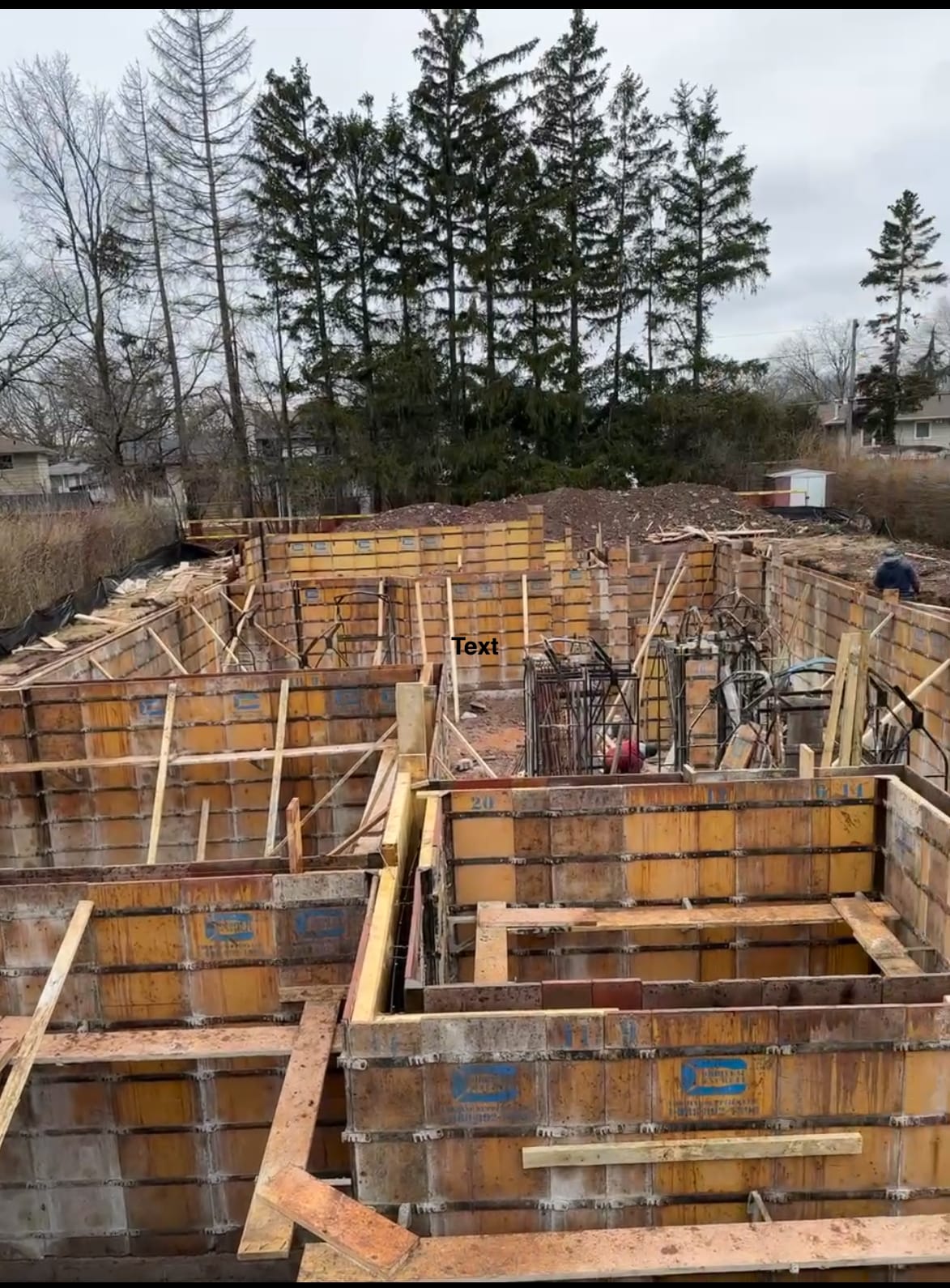 Completed foundation with waterproofing membrane applied to exterior walls in Burlington
