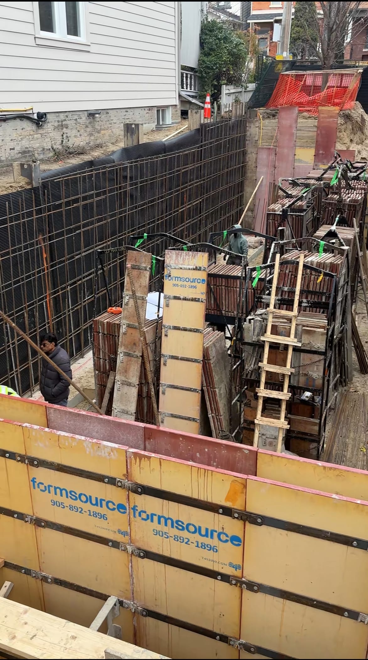 Detailed rebar installation against blindside formwork for East York foundation wall construction