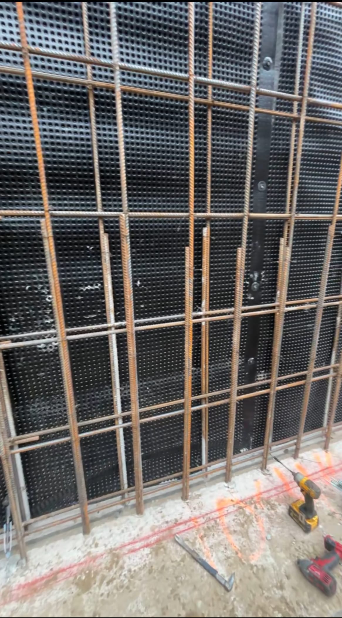 Foundation walls rising with blindside formwork and tie system in East York project