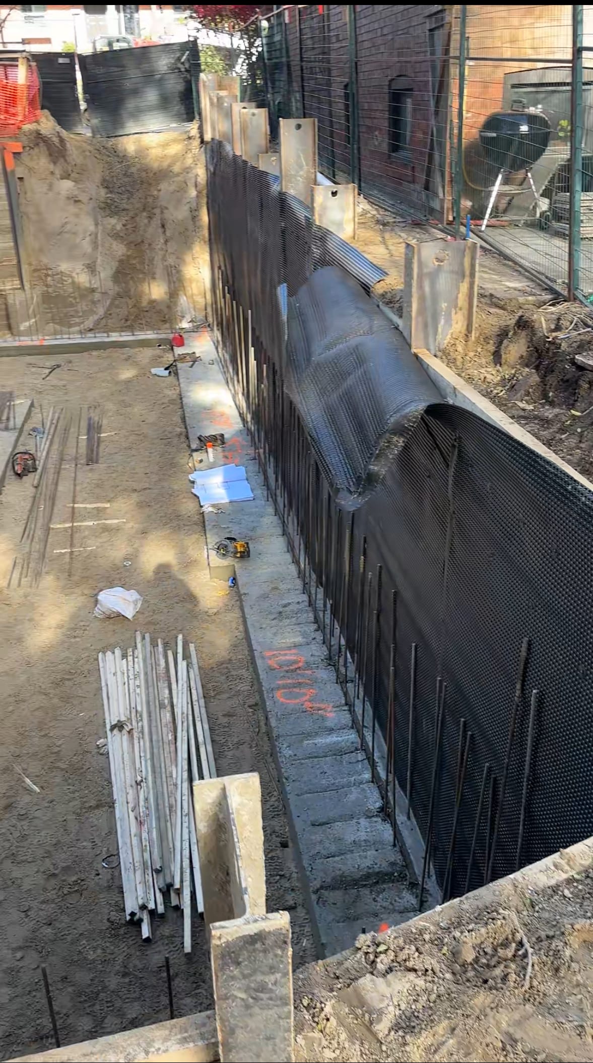 Completed and waterproofed foundation walls after form removal in East York Toronto