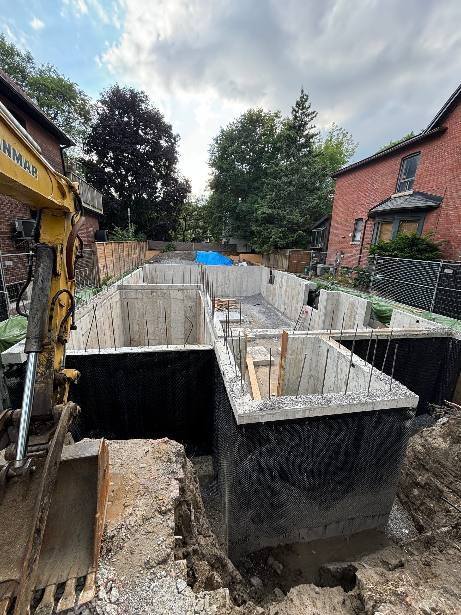 East York foundation project with completed concrete walls before backfill stage