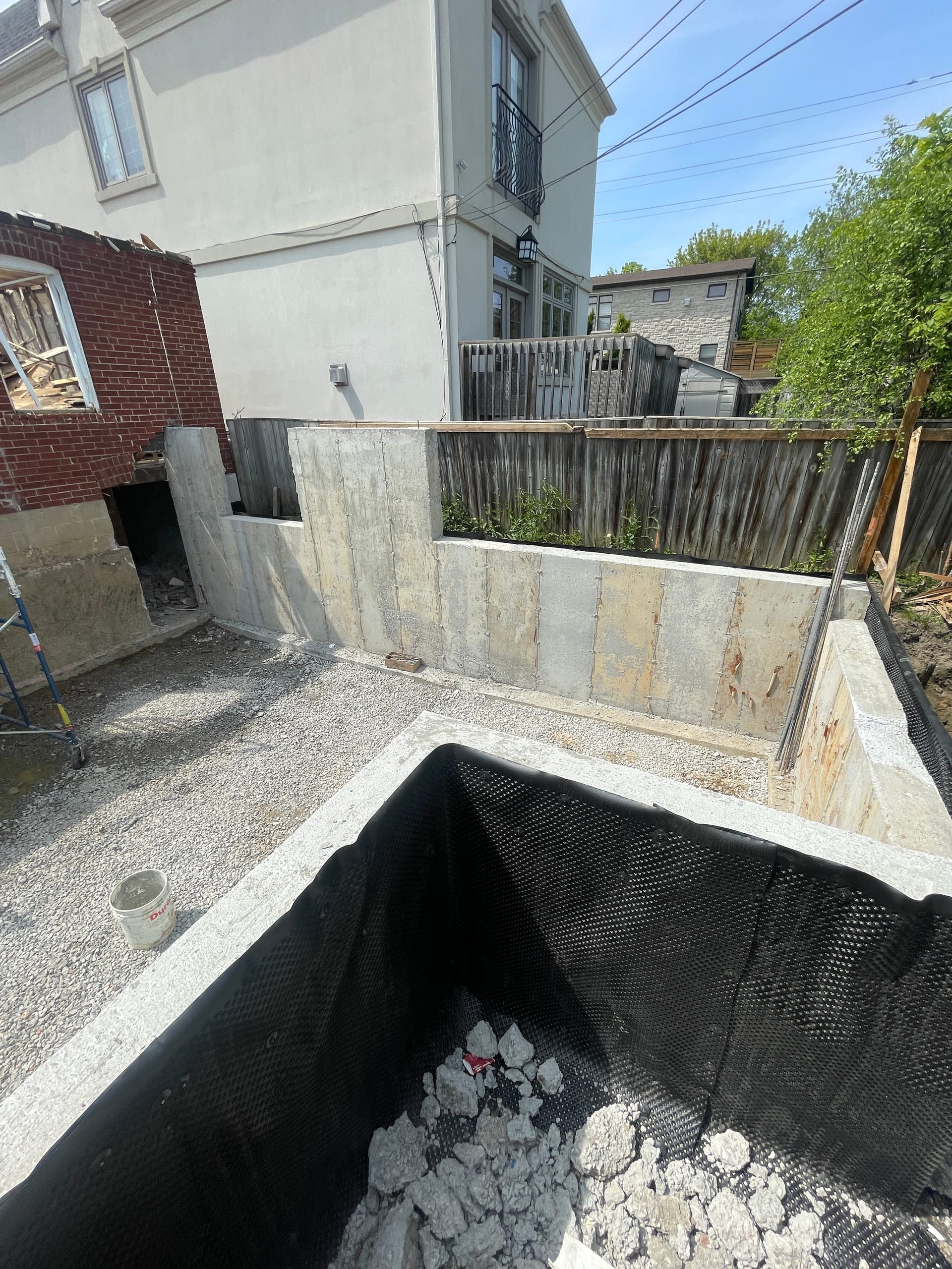 Concrete foundation extension walls completed in East York awaiting waterproofing application