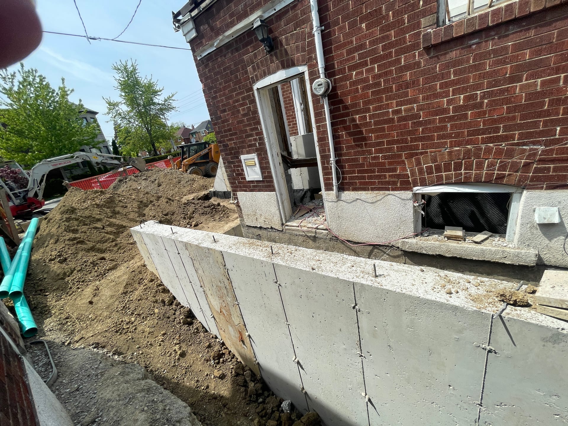 Waterproofing membrane applied to completed foundation extension in East York Toronto