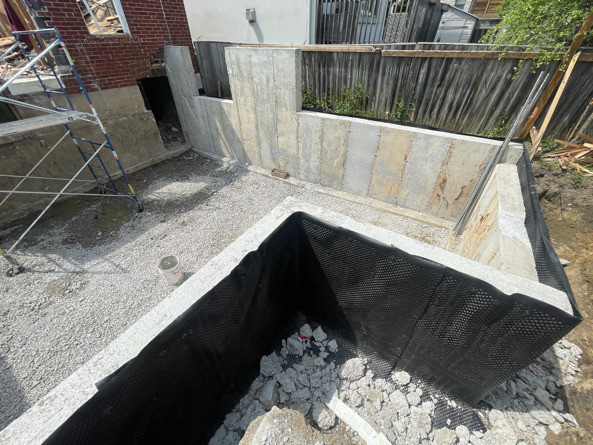 East York foundation extension with complete waterproofing ready for backfill operations