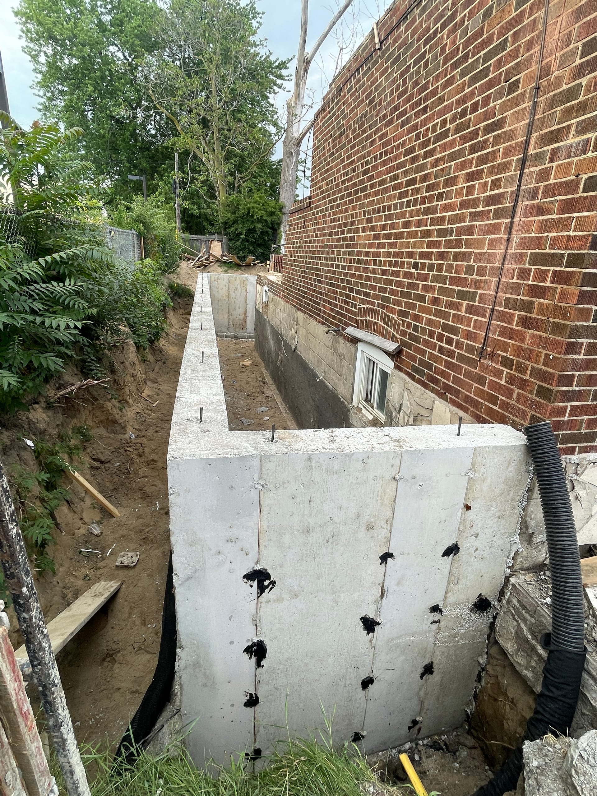 Foundation extension waterproofing with weeping tile installation in East York Toronto
