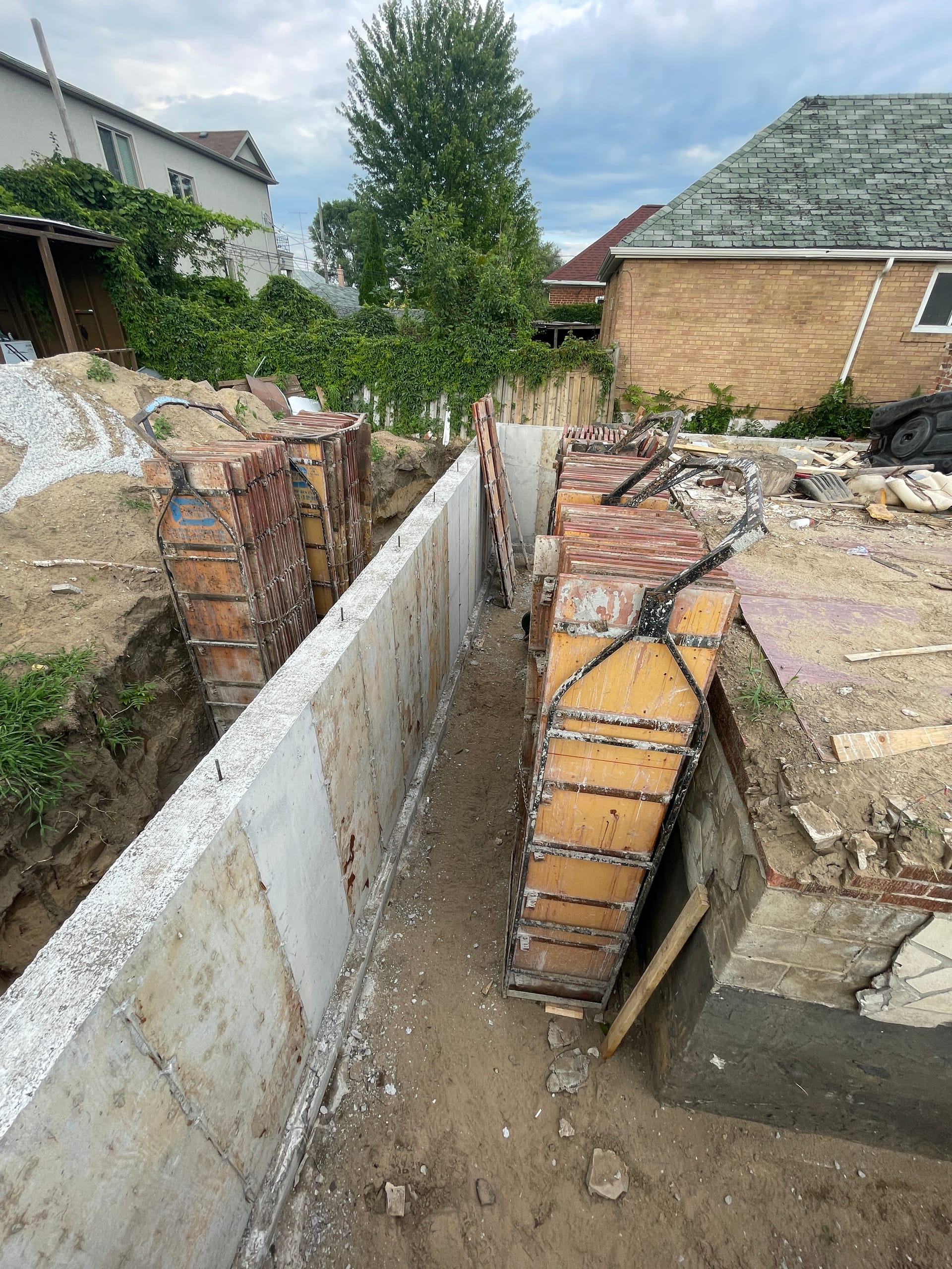 Stripped concrete extension walls ready for waterproofing in East York Toronto