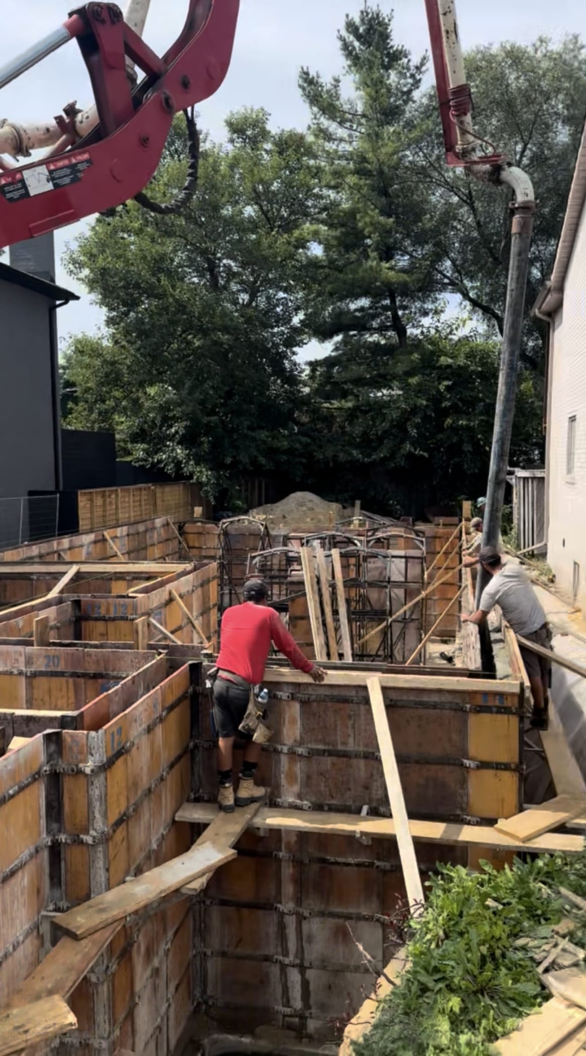 Foundation wall concrete pour with bracing system in East York residential construction