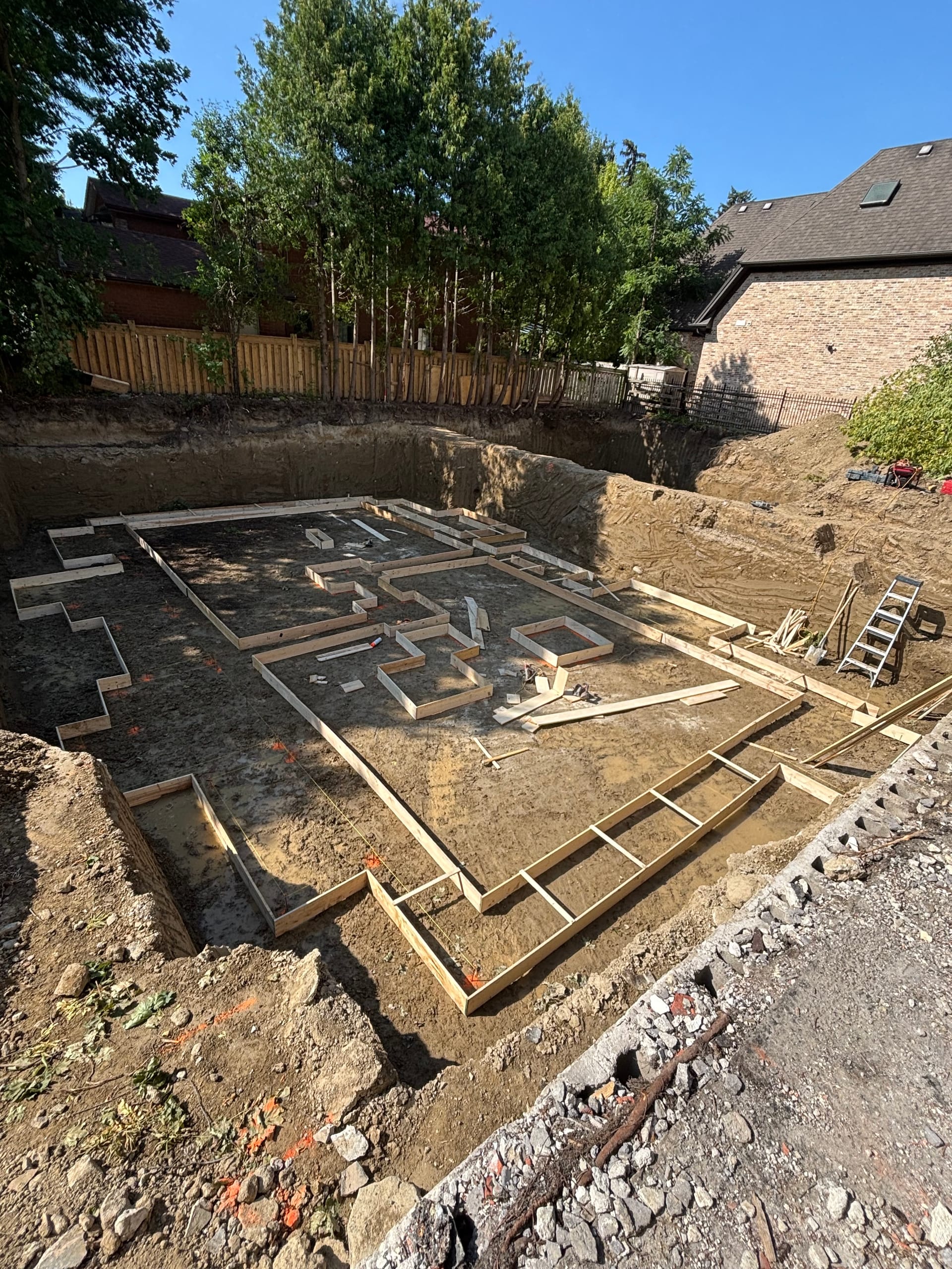 Footing formwork installation for multiplex foundation project in Etobicoke Toronto