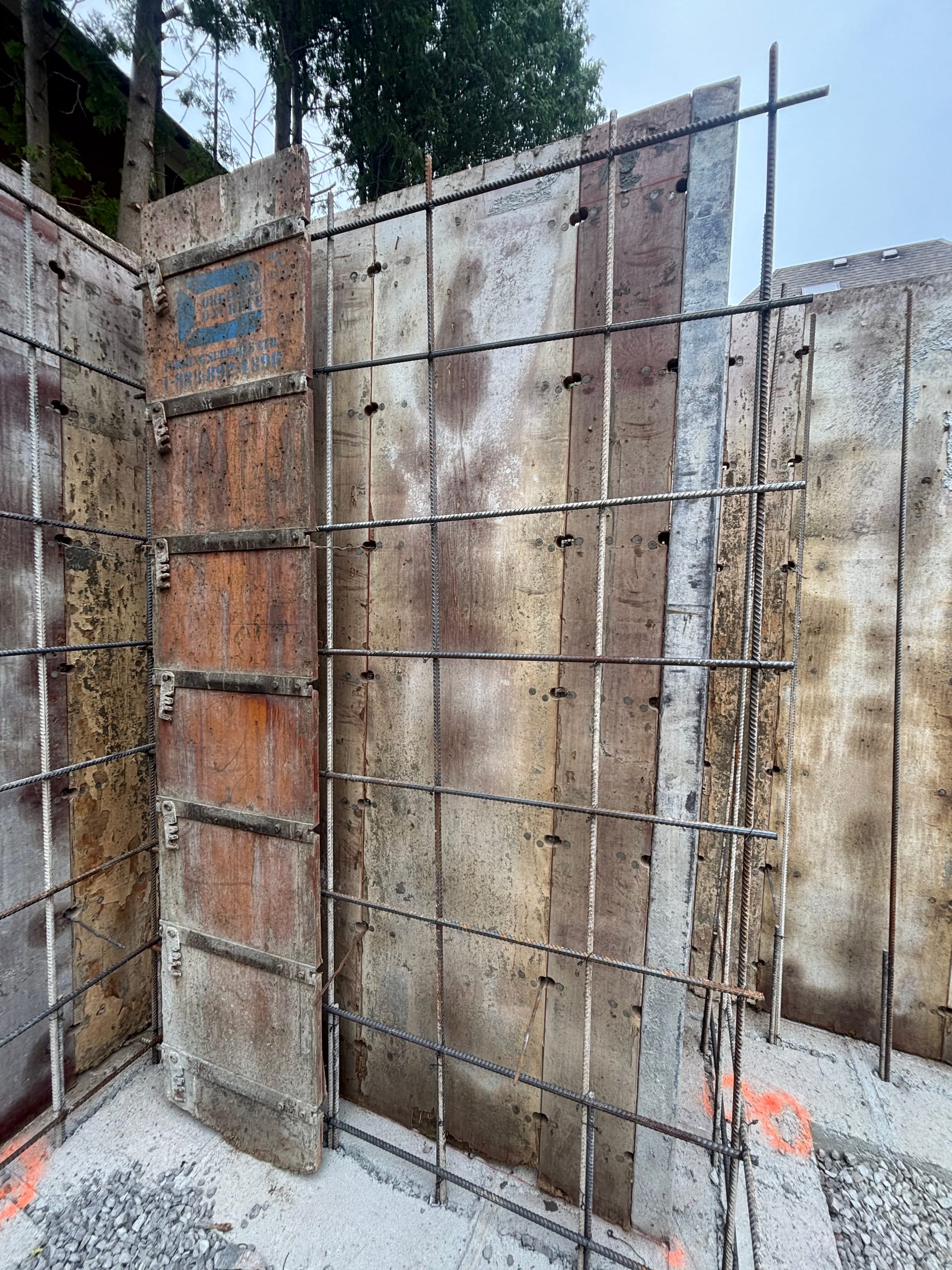 Fresh concrete pour for multiplex footing installation at Etobicoke construction site