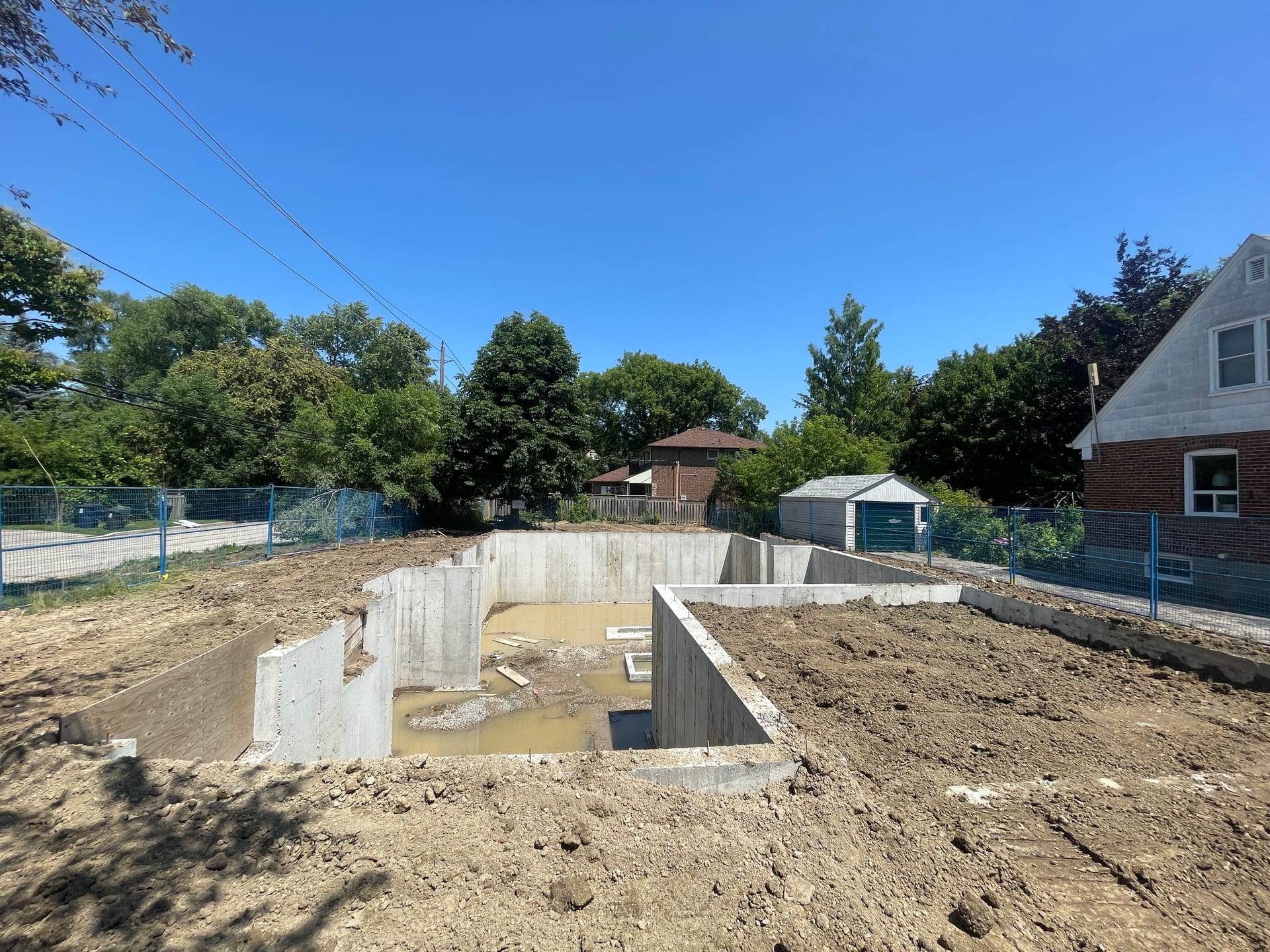 Foundation wall formwork assembly in progress at Etobicoke residential construction site