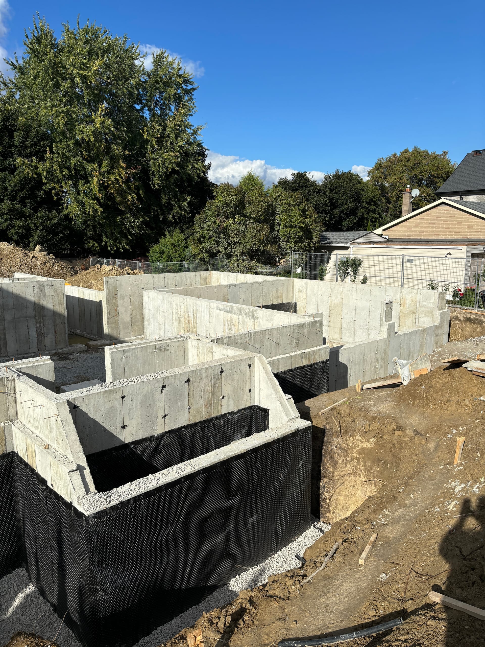 Completed residential foundation with waterproofing membrane in King City York Region