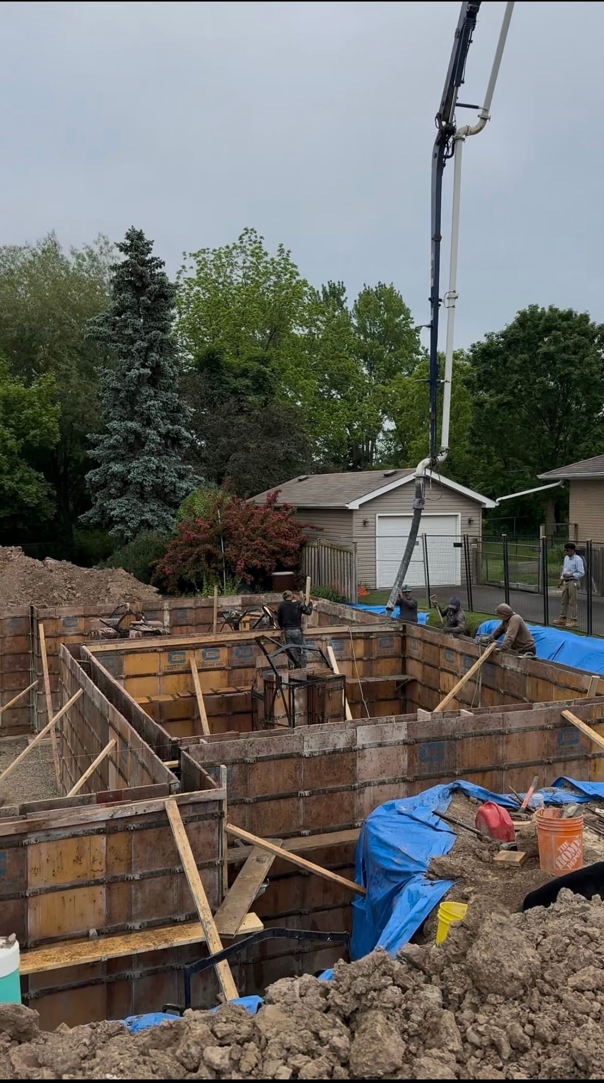 Exposed concrete foundation walls in Milton ready for waterproofing membrane application