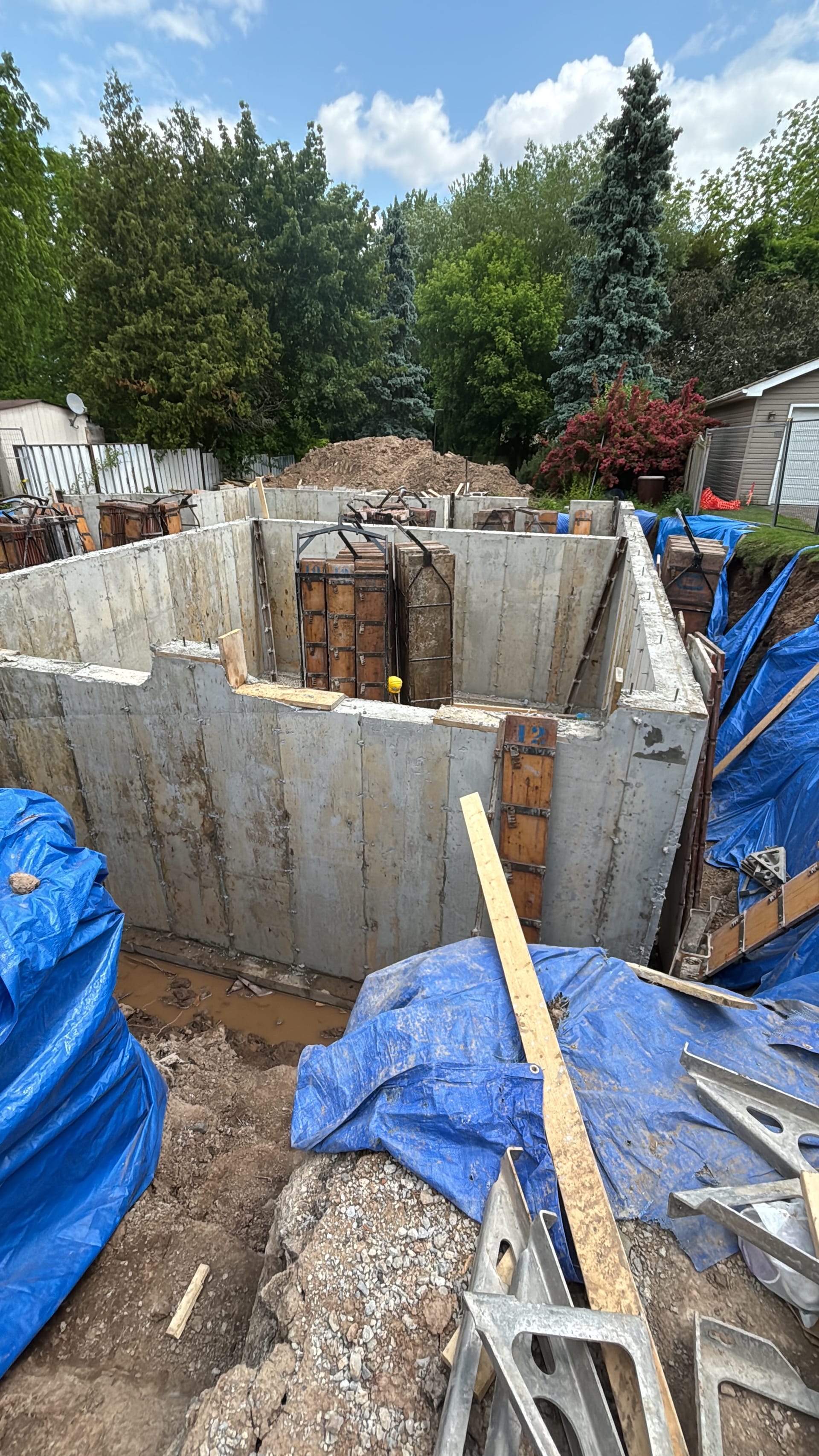 Milton foundation walls during waterproofing application at 320 Kingsleigh Court residential construction site