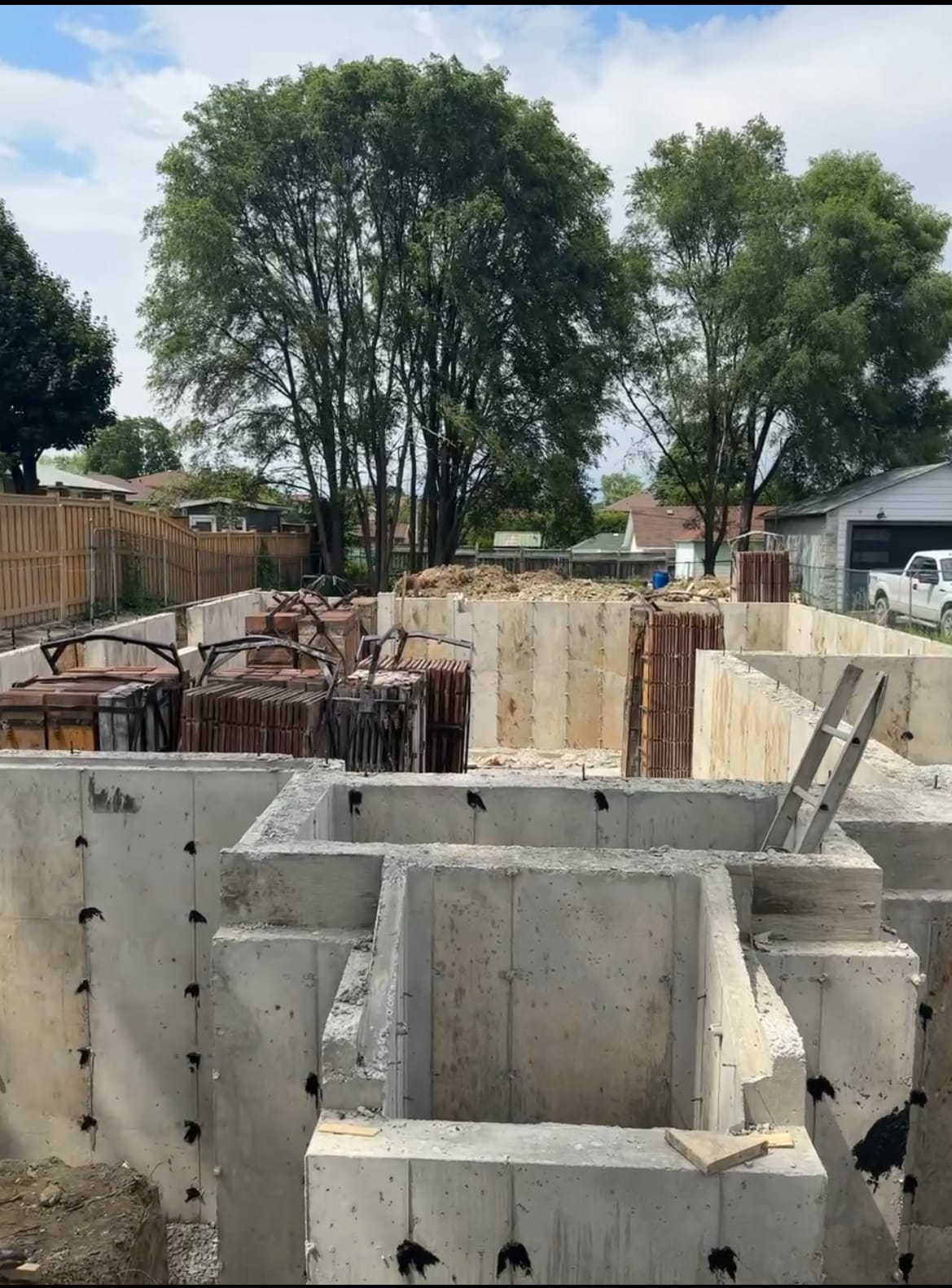 Waterproofing application on North York foundation walls with form tie holes sealed using hydraulic cement