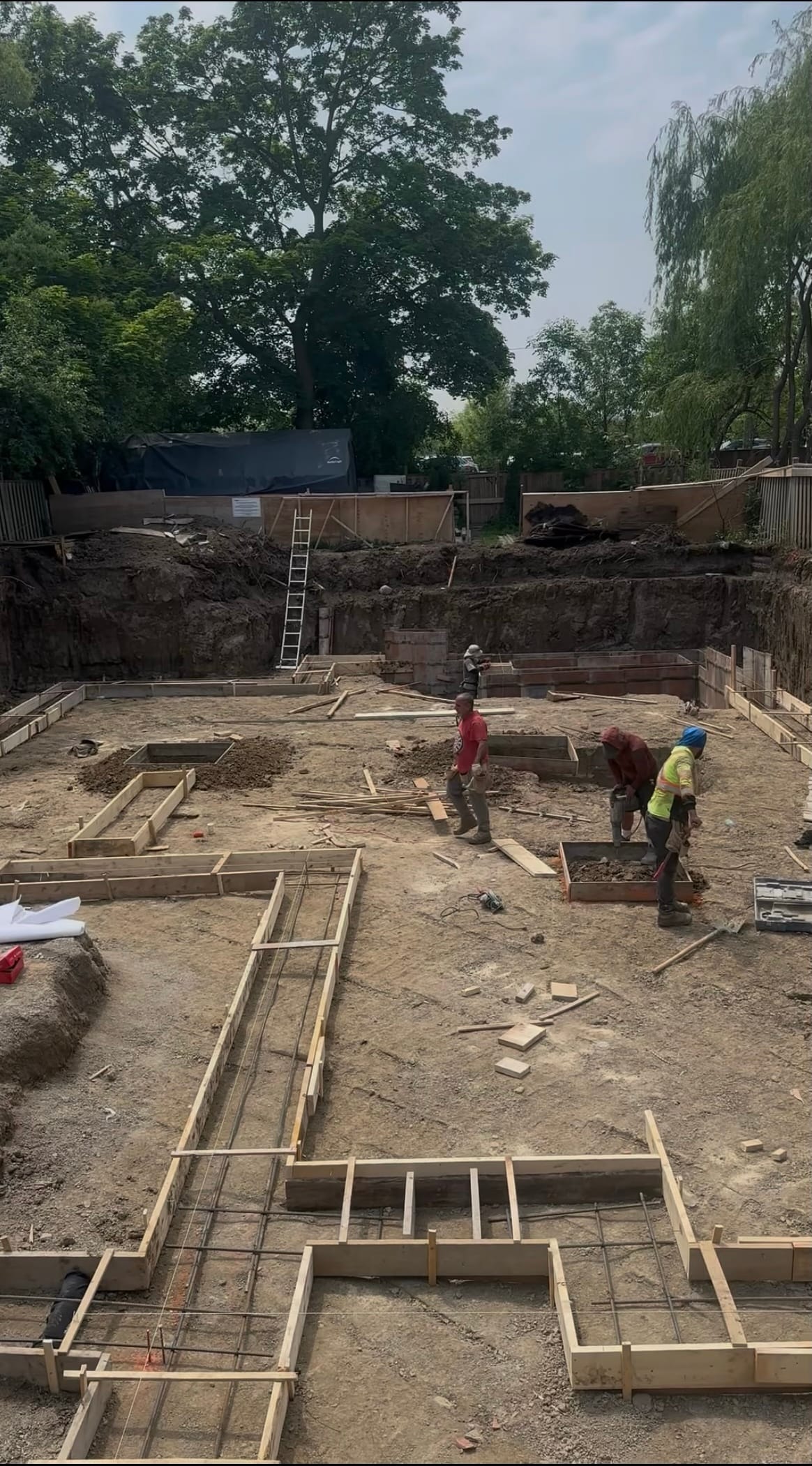 Completed waterproofed residential foundation ready for backfill in North York Toronto