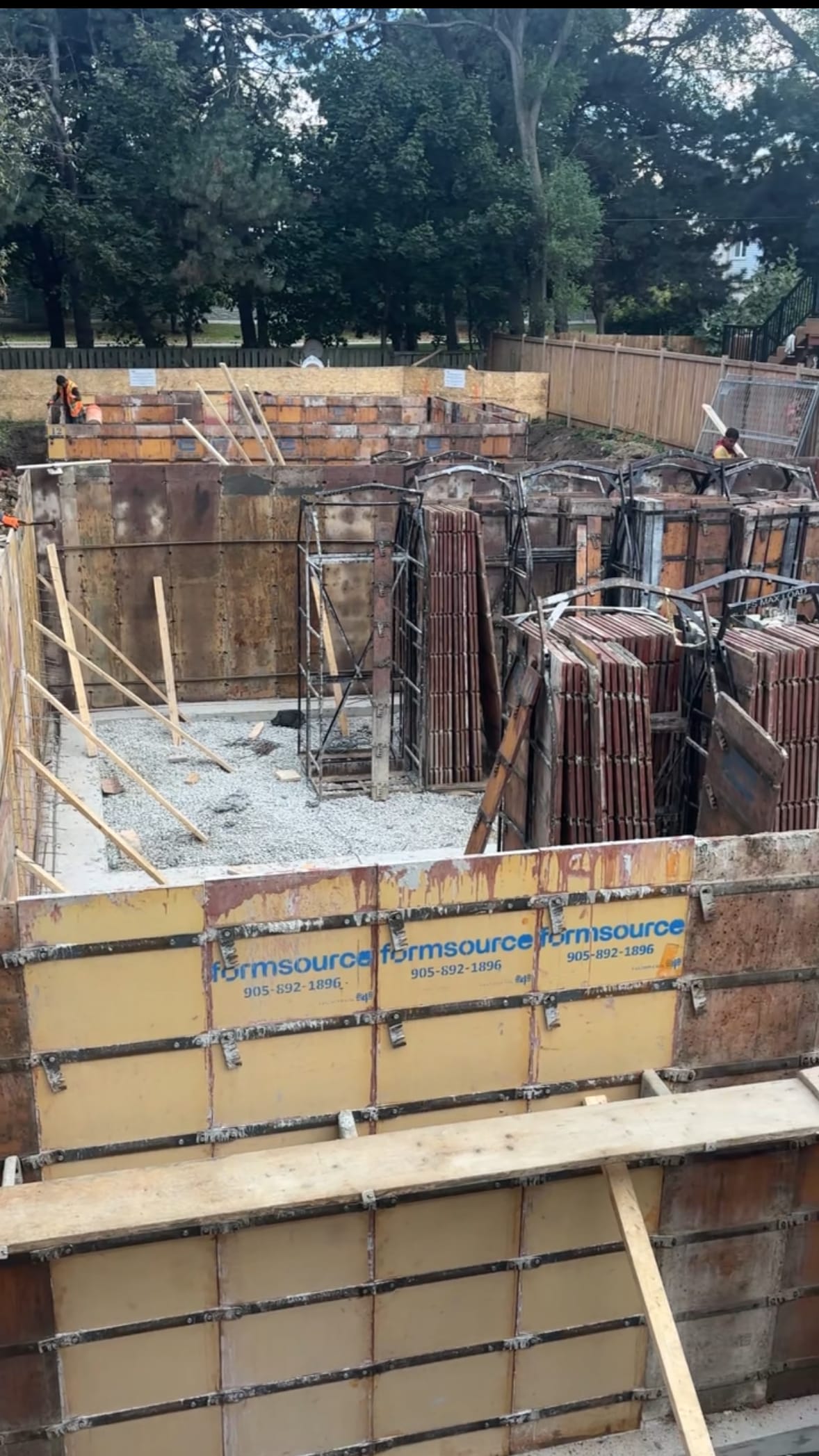 Concrete wall formwork assembly for North York multiplex foundation before rebar installation