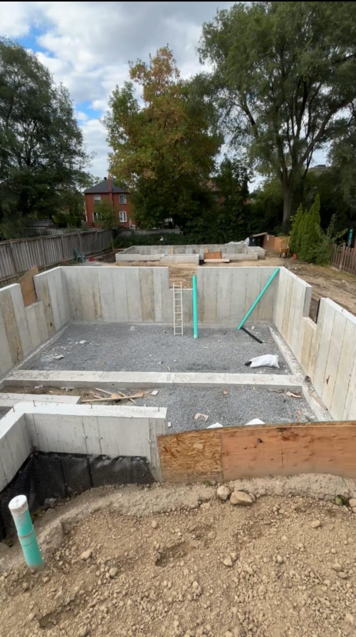 Reinforcement cages positioned in multiplex foundation forms during wall assembly in North York