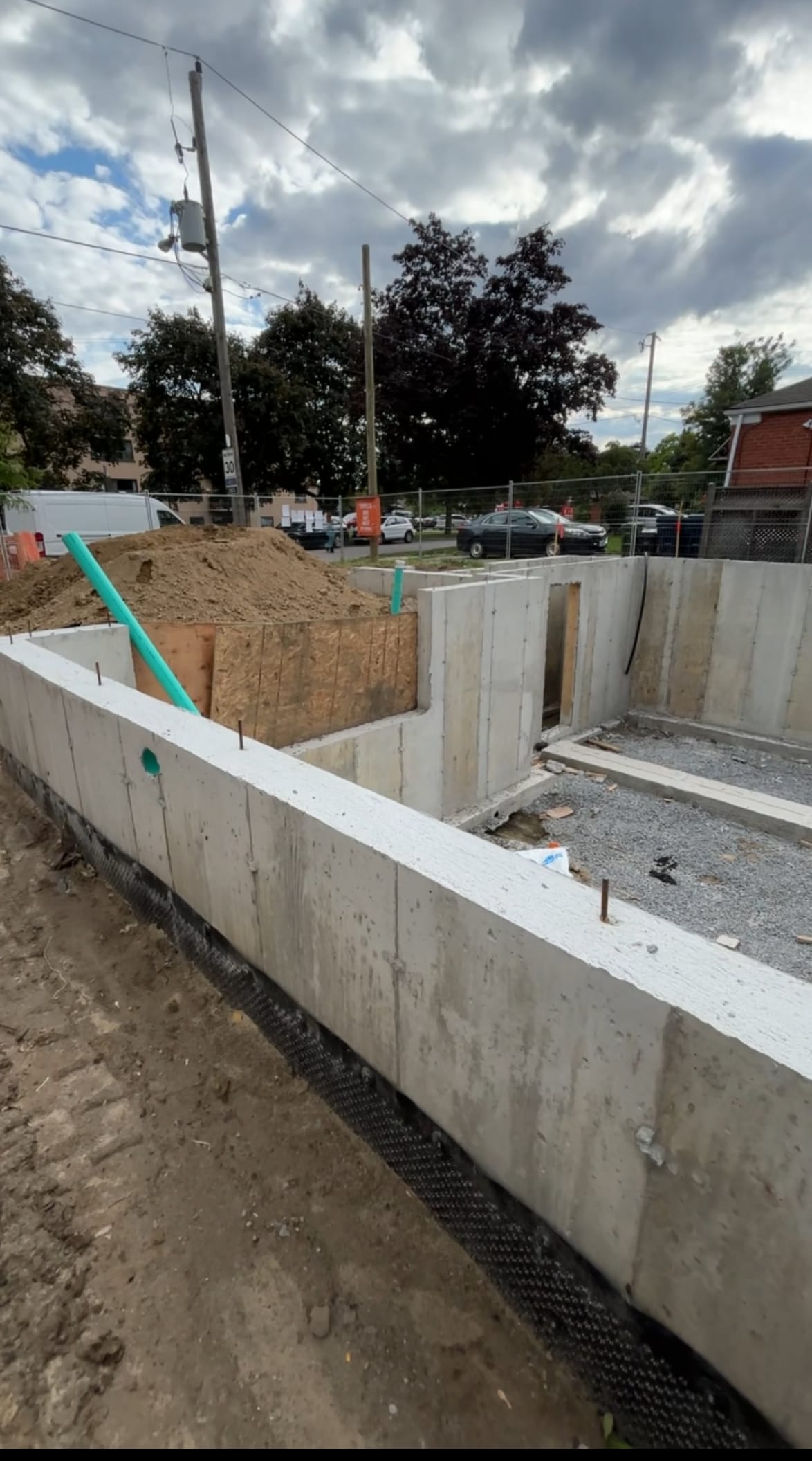 Backfilled multiplex foundation walls viewed from alternate angle in North York Toronto