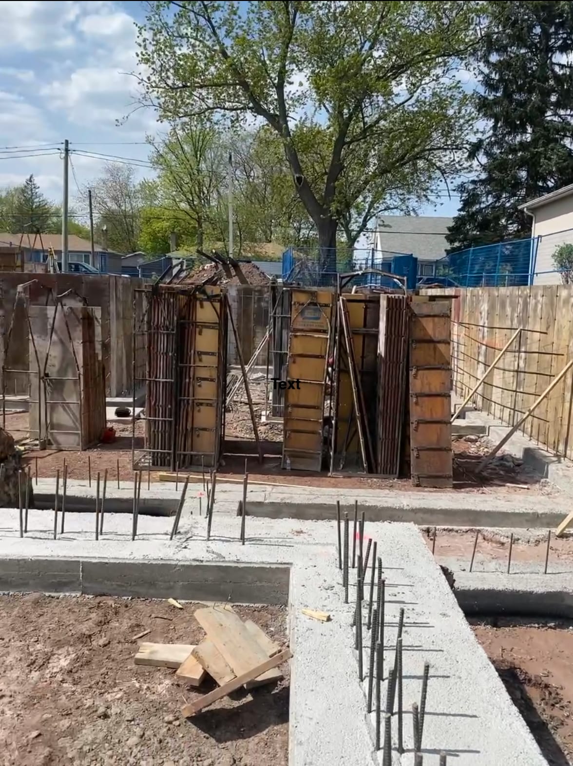 Footing formwork and rebar installation for Oakville residential foundation before concrete pour