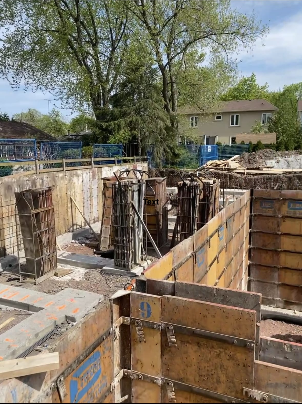 Stripped footing forms and wall rebar placement for Oakville foundation construction project