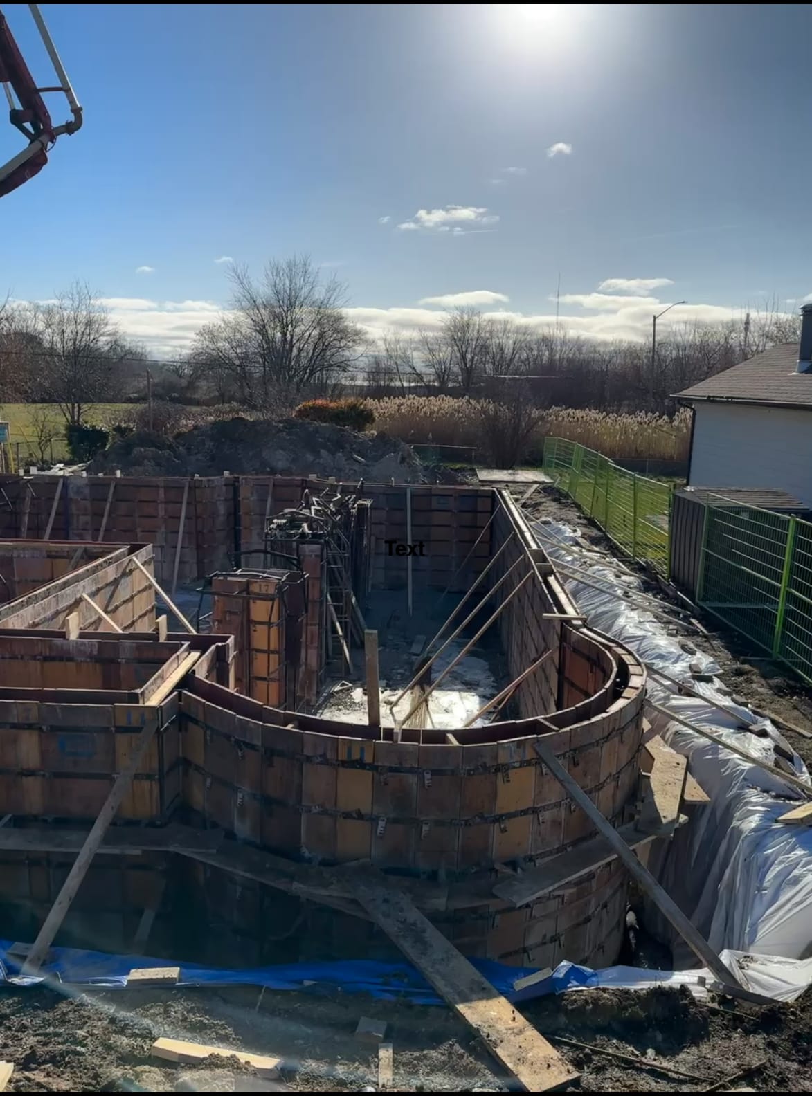Curved concrete wall formwork braced and ready for pouring at Pickering foundation project