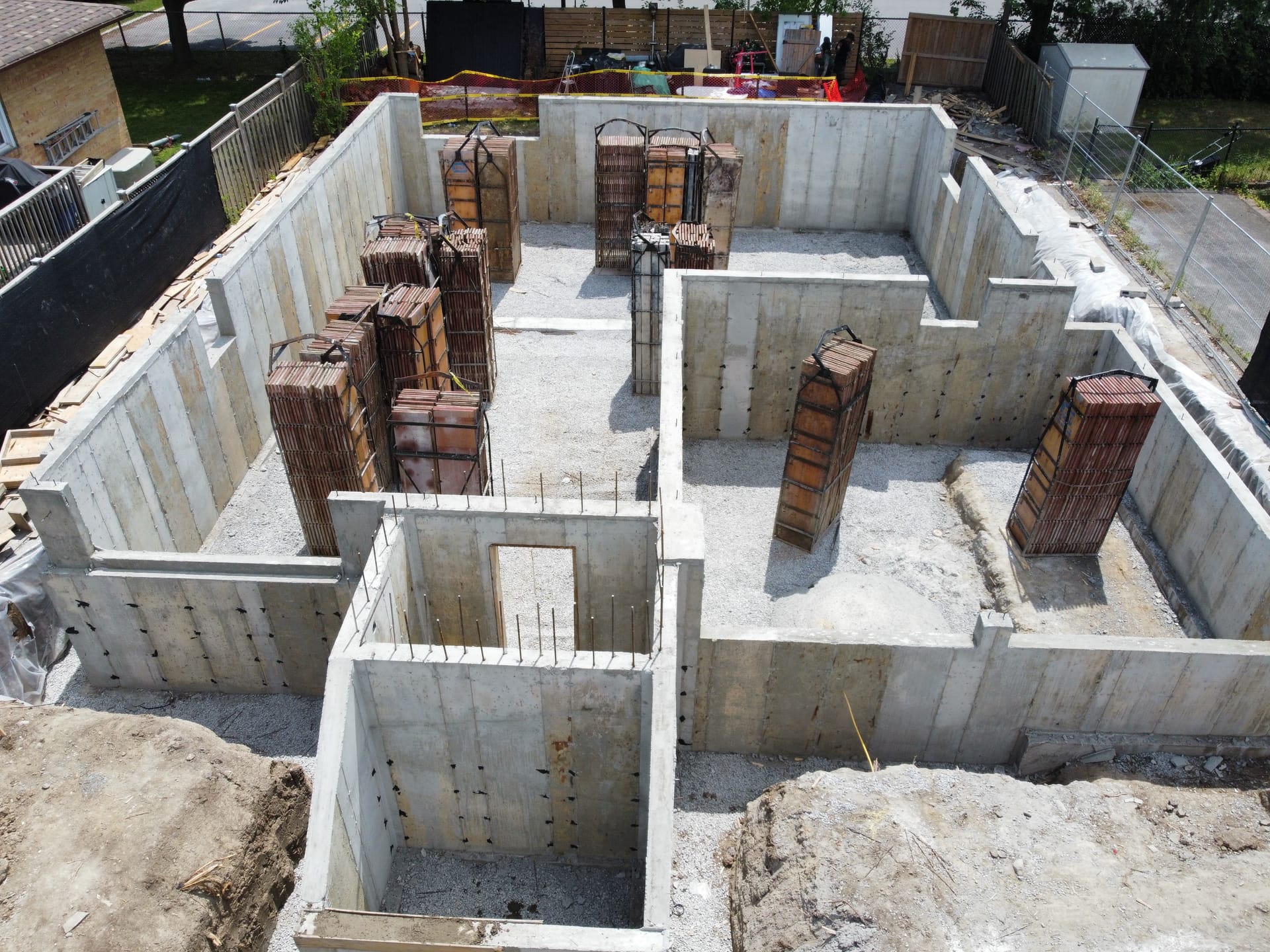 Aerial view of poured concrete foundation showing interior walls and window openings Richmond Hill