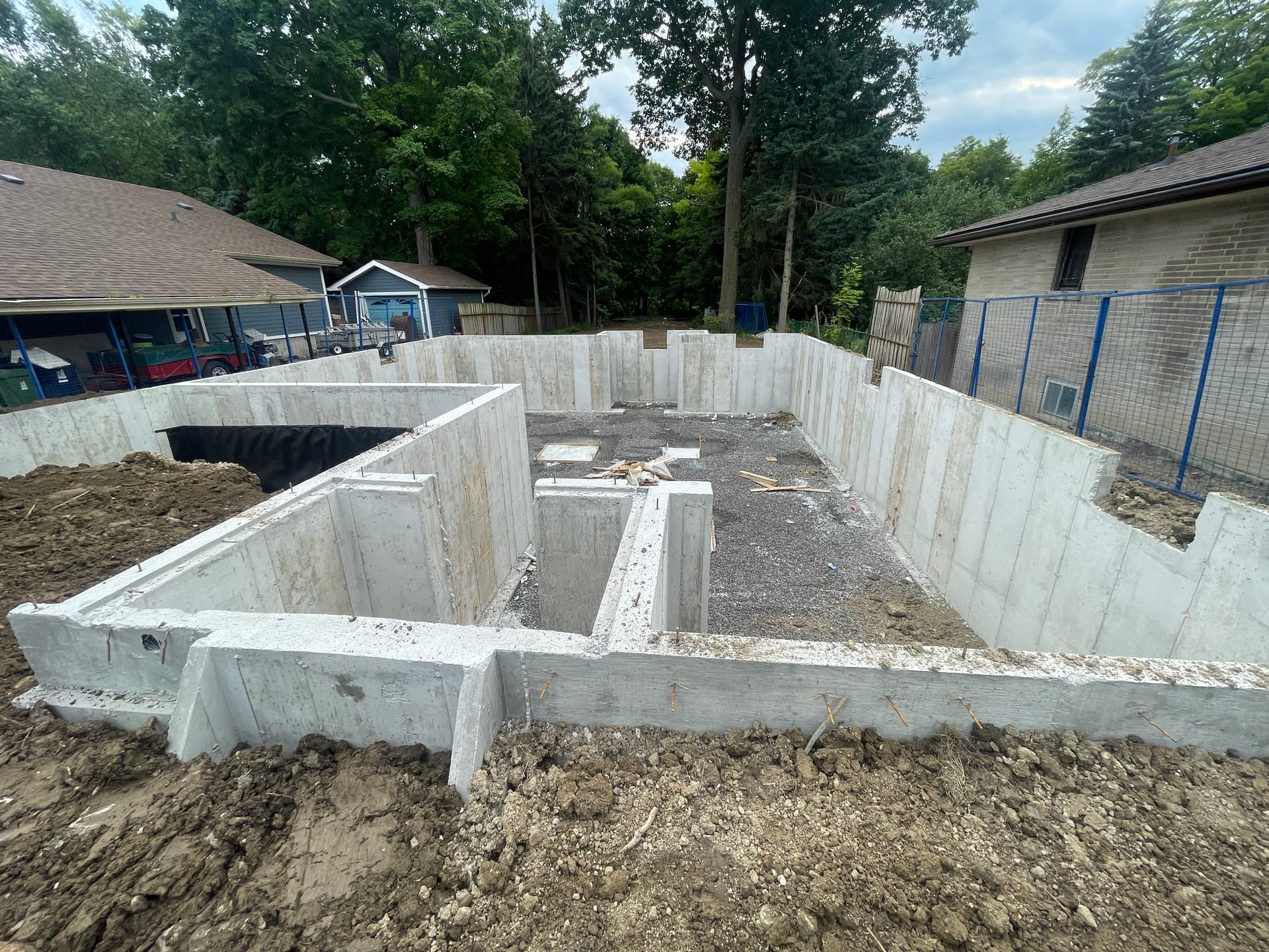 Completed concrete foundation walls with backfill in Scarborough residential construction project