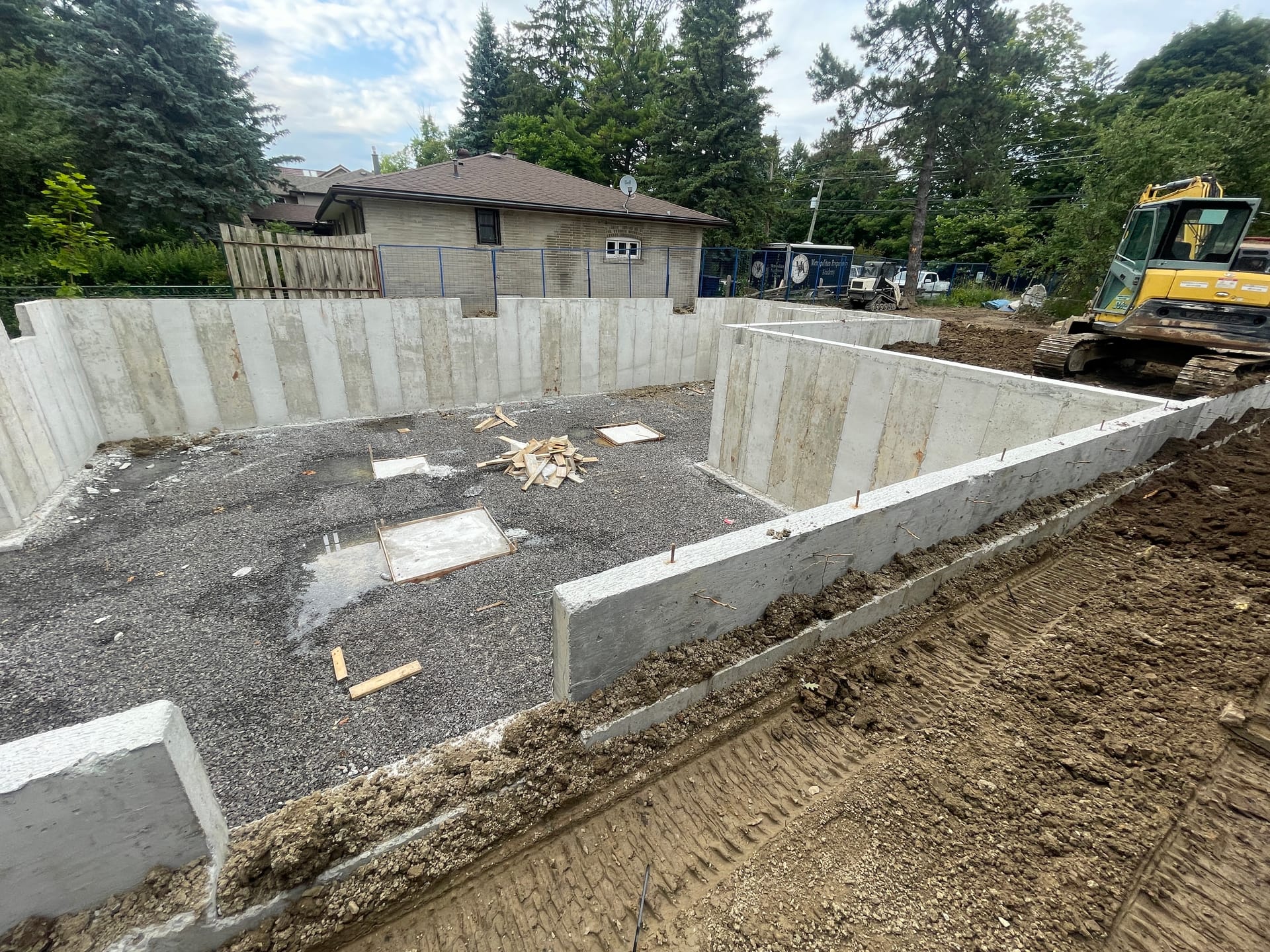 Scarborough concrete foundation walls showing finished formwork and structural detail after backfill
