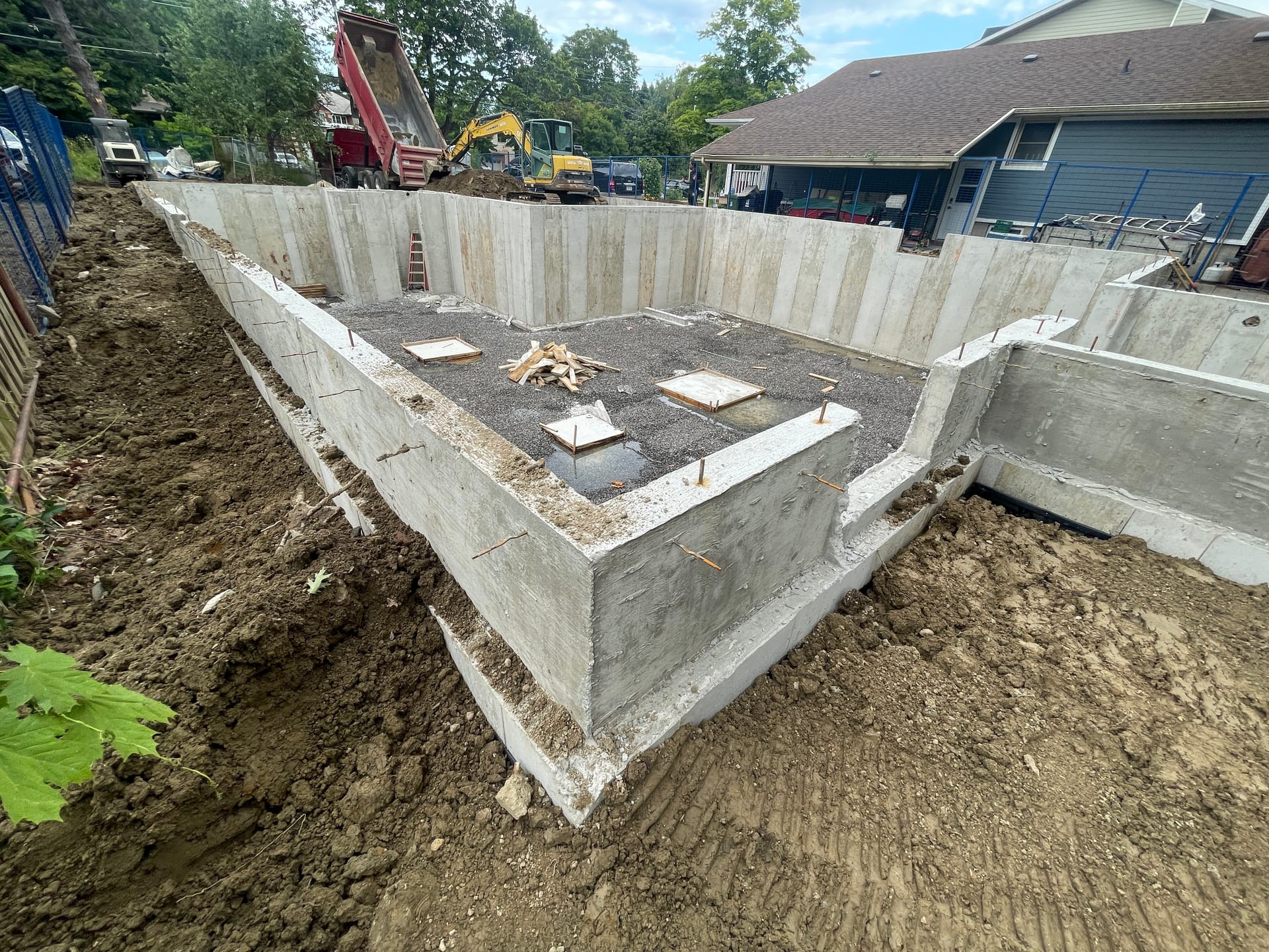 Final view of Scarborough residential foundation with backfill operations and site preparation complete