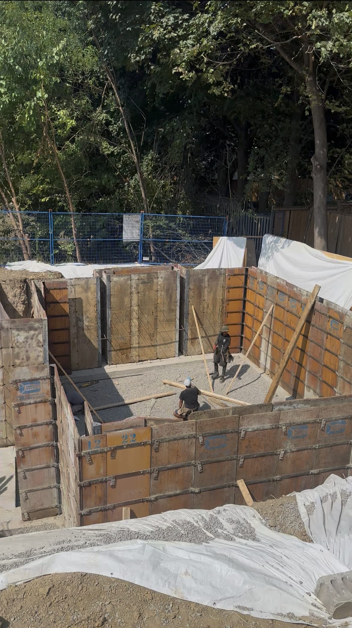 Finished multiplex foundation walls with waterproofing in Scarborough